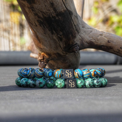  De Aqua Terra Stones armband omarmt de kalmerende groene tinten van de natuur, terwijl de Jupiter Mixed Stones armband een levendige mix van kleuren en energie uitstraalt.