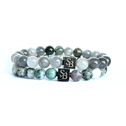 Twee Elegance Sets (8mm) van Stoney Bracelets met de initialen s en b erop.