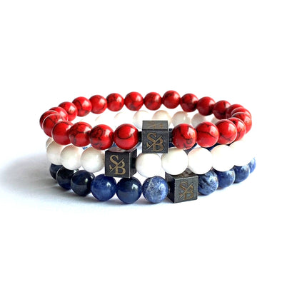 Drie armbanden met rode, witte en blauwe Dutch Set (8mm) kralen van Stoney Bracelets.